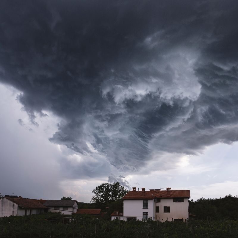 A huge storm forming above houses